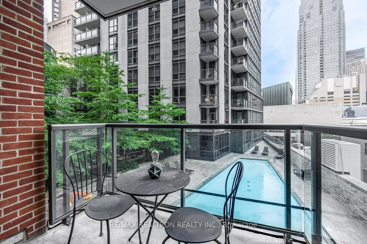 Balcony with pool and treed views