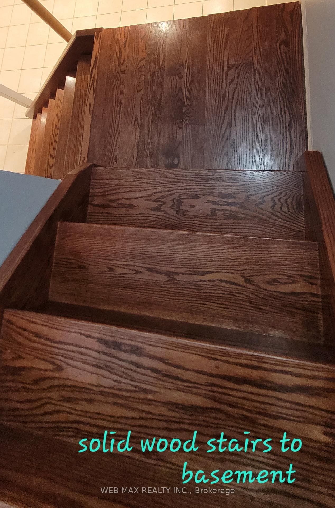 Solid wood stairs leading to basement