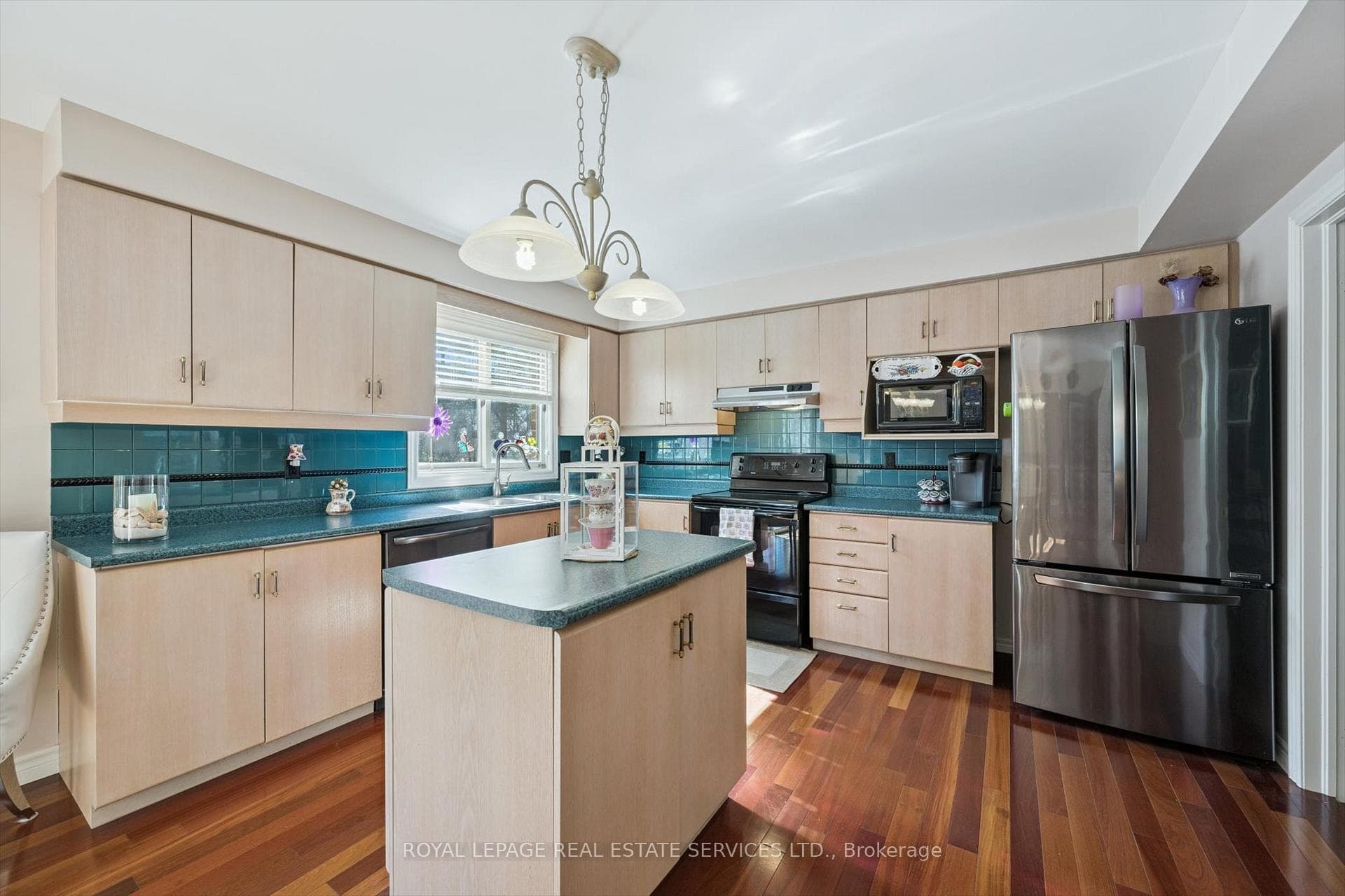 Kitchen Features a Centre Island & Generous Pantry