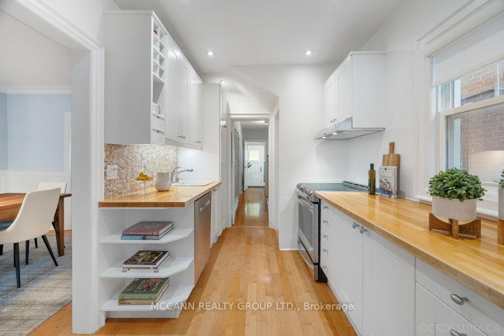 Kitchen with butcher block countertop.