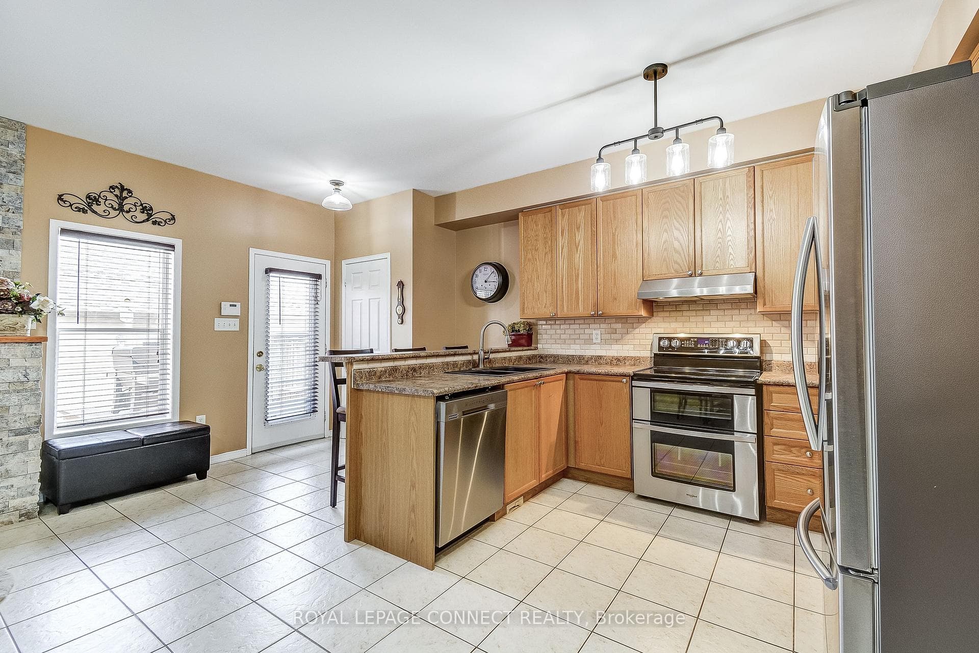 Kitchen Door Leads to Back Deck & Patio