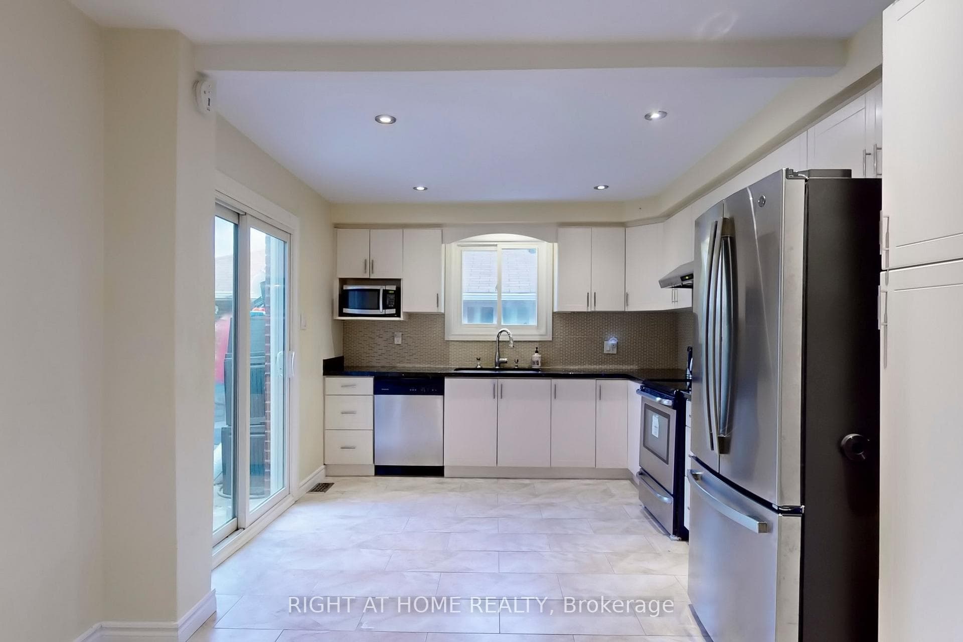 Modern Kitchen with Walk-Out to Patio