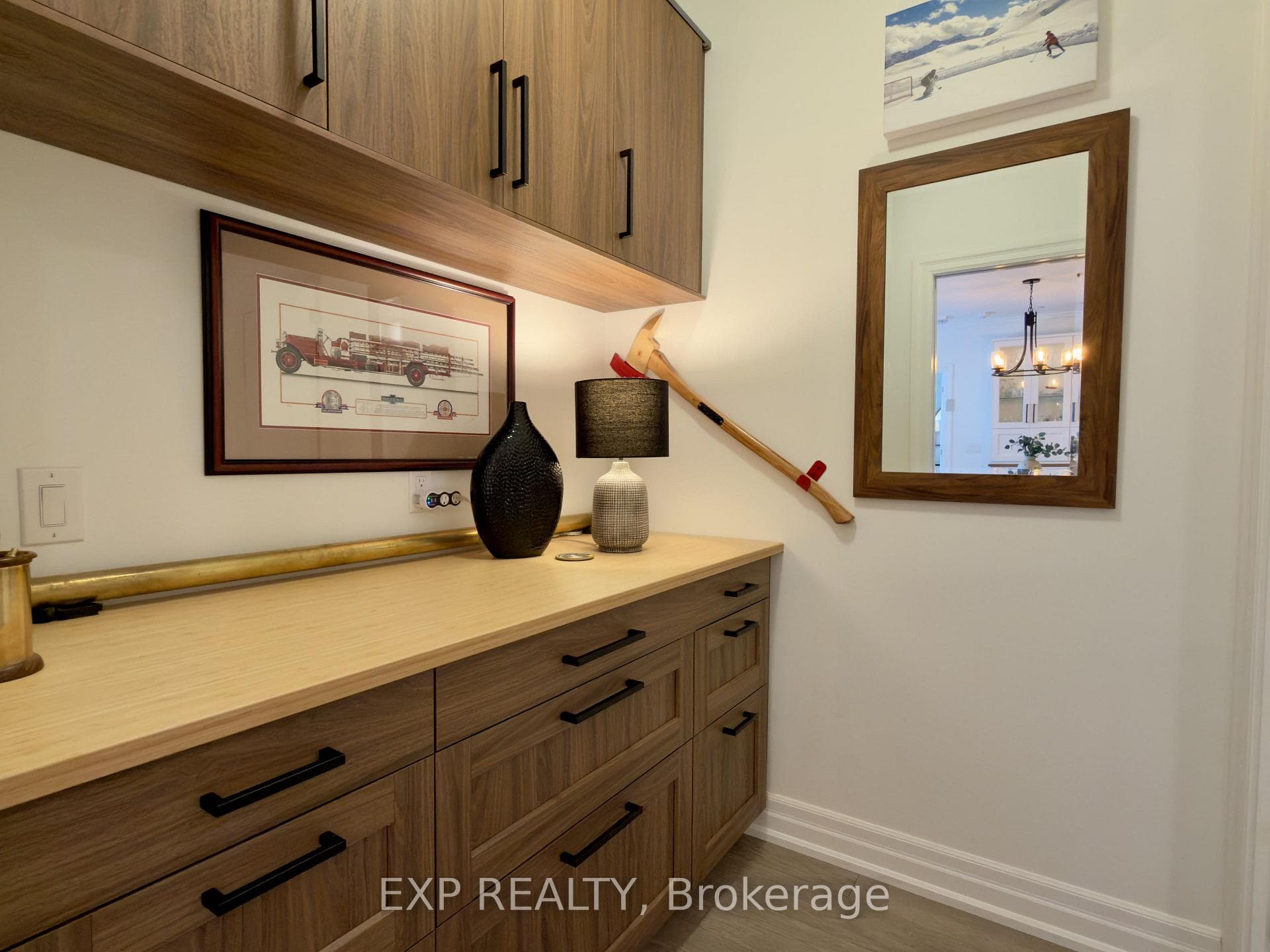 Built-in desk and overhead cabinets for storage.