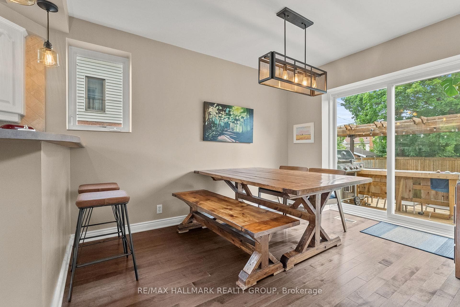 Bright dining area overlooking backyard deck