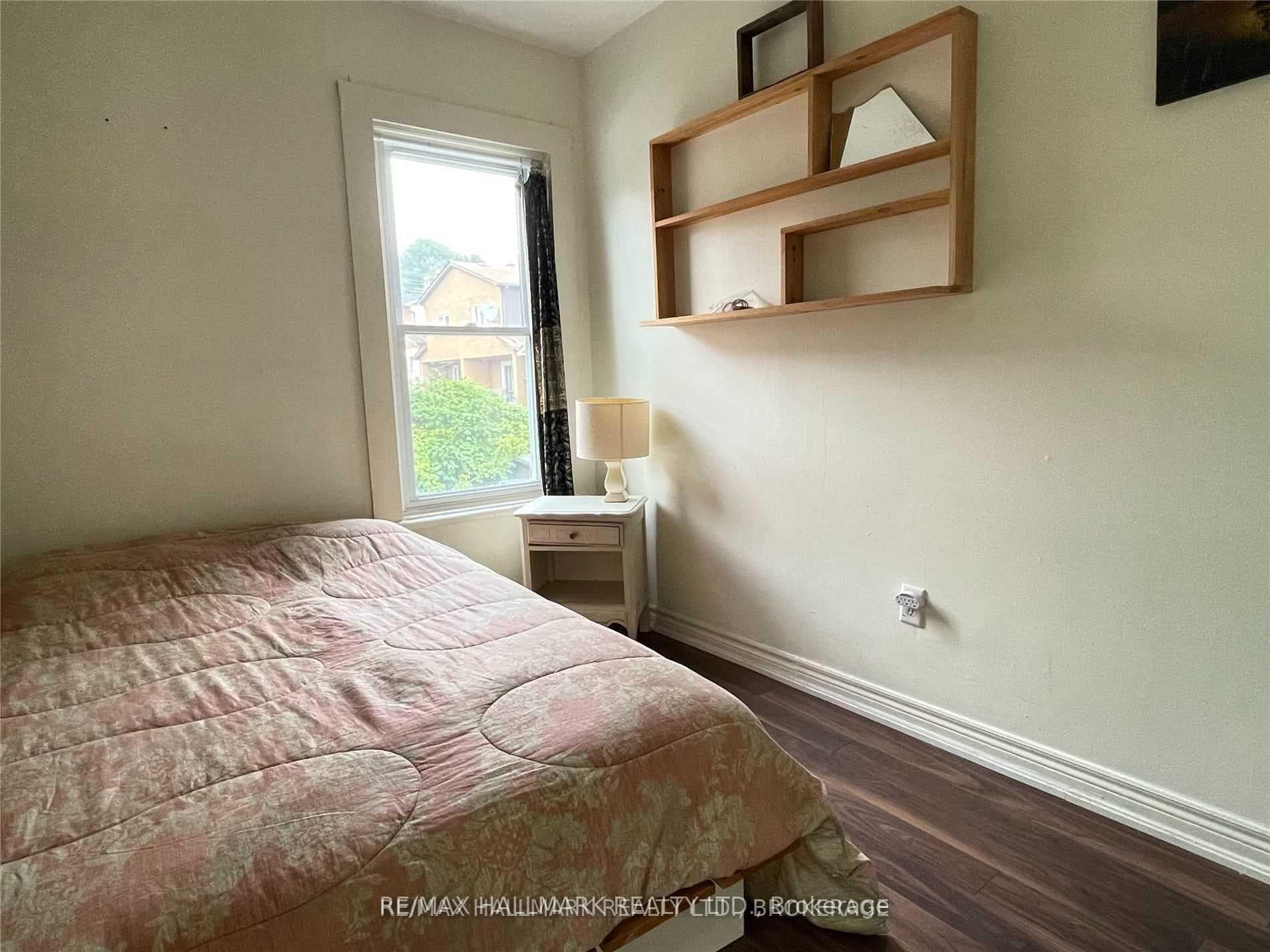 Rear bedroom furnished by tenant