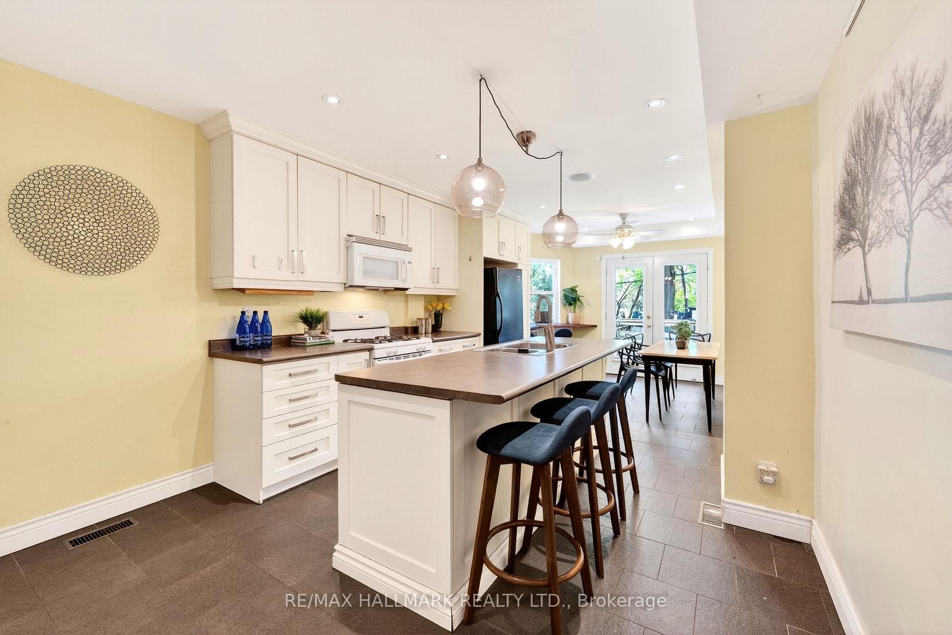 White shaker style kitchen & Counter seating for 3