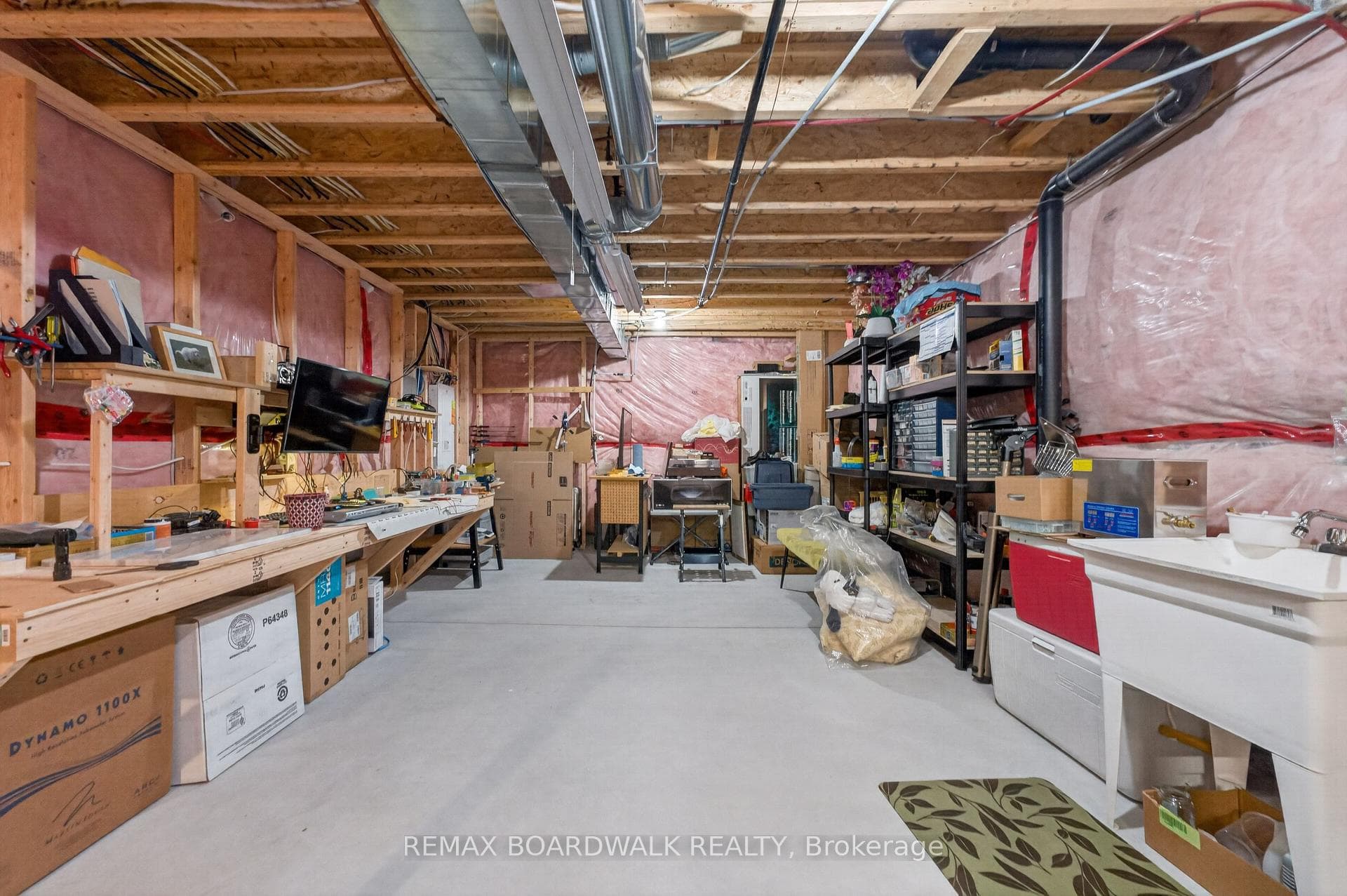 Basement has Plenty of Storage + Laundry Tub!