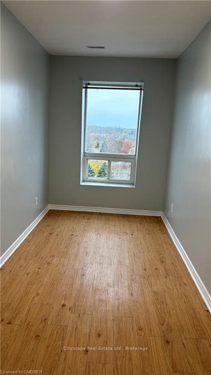 Unfurnished room featuring light wood-type floorin