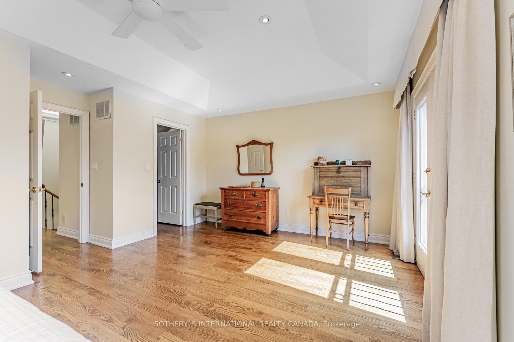 Luxurious primary bedroom with ensuite bath