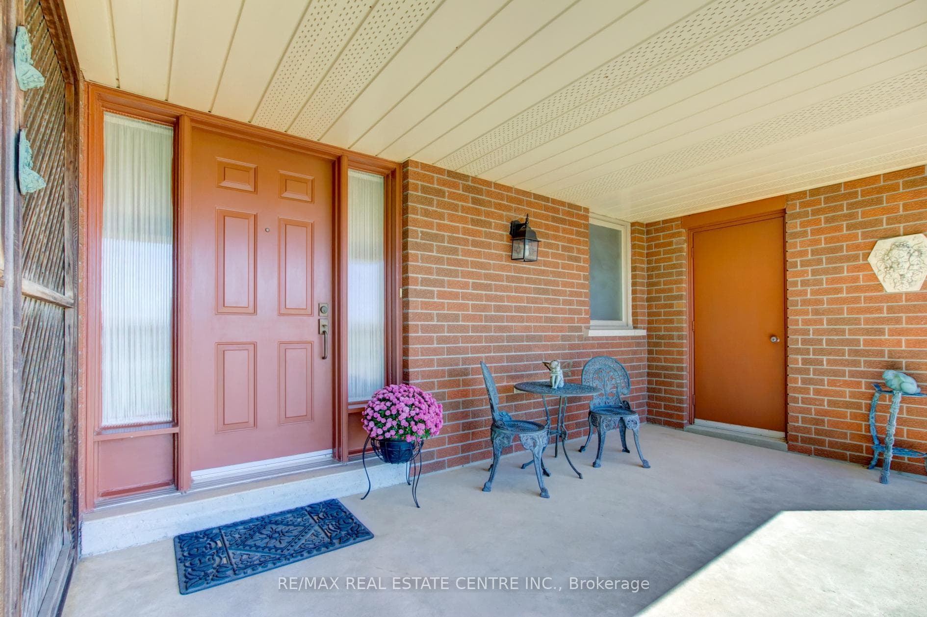 Front entrance-side door to garage