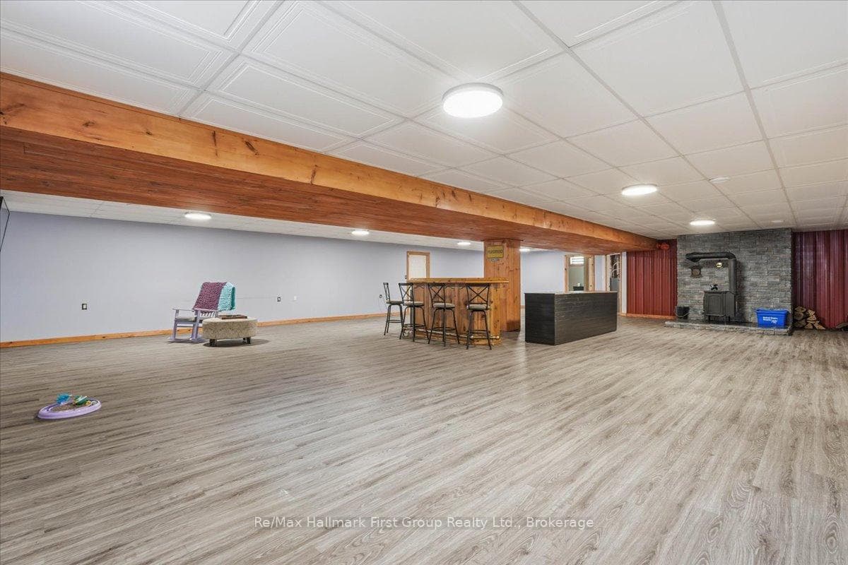 Spacious Open Rec Room and Bar Area With Woodstove