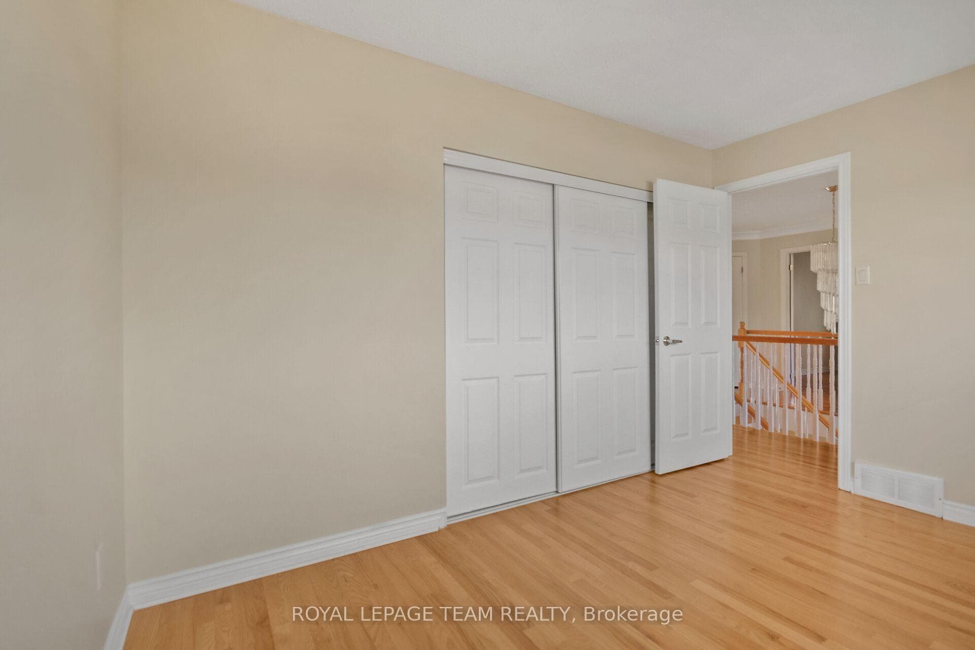 Bedroom 2 with hardwood and large closet.