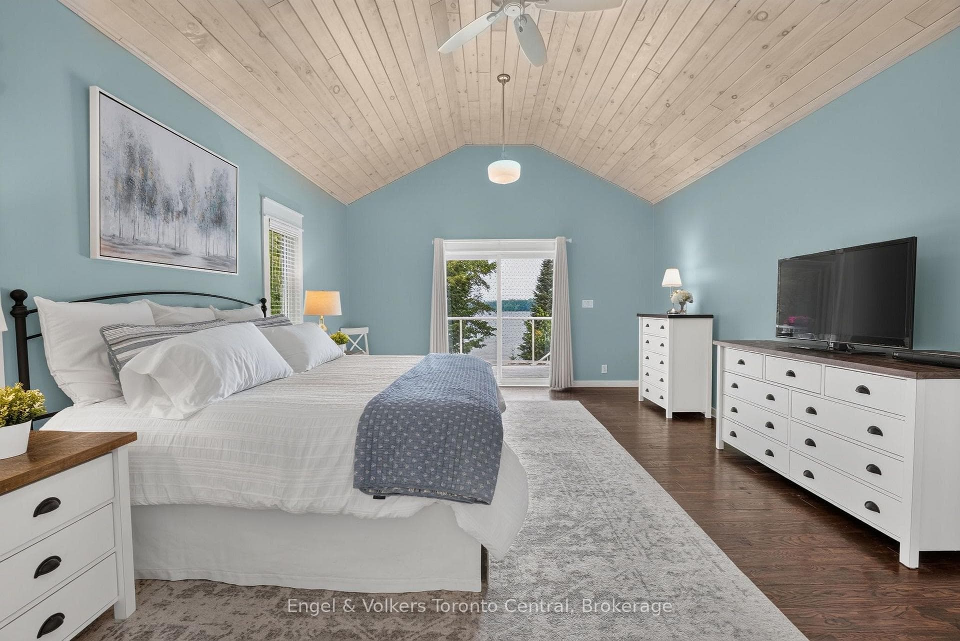 Primary bedroom with a lake view
