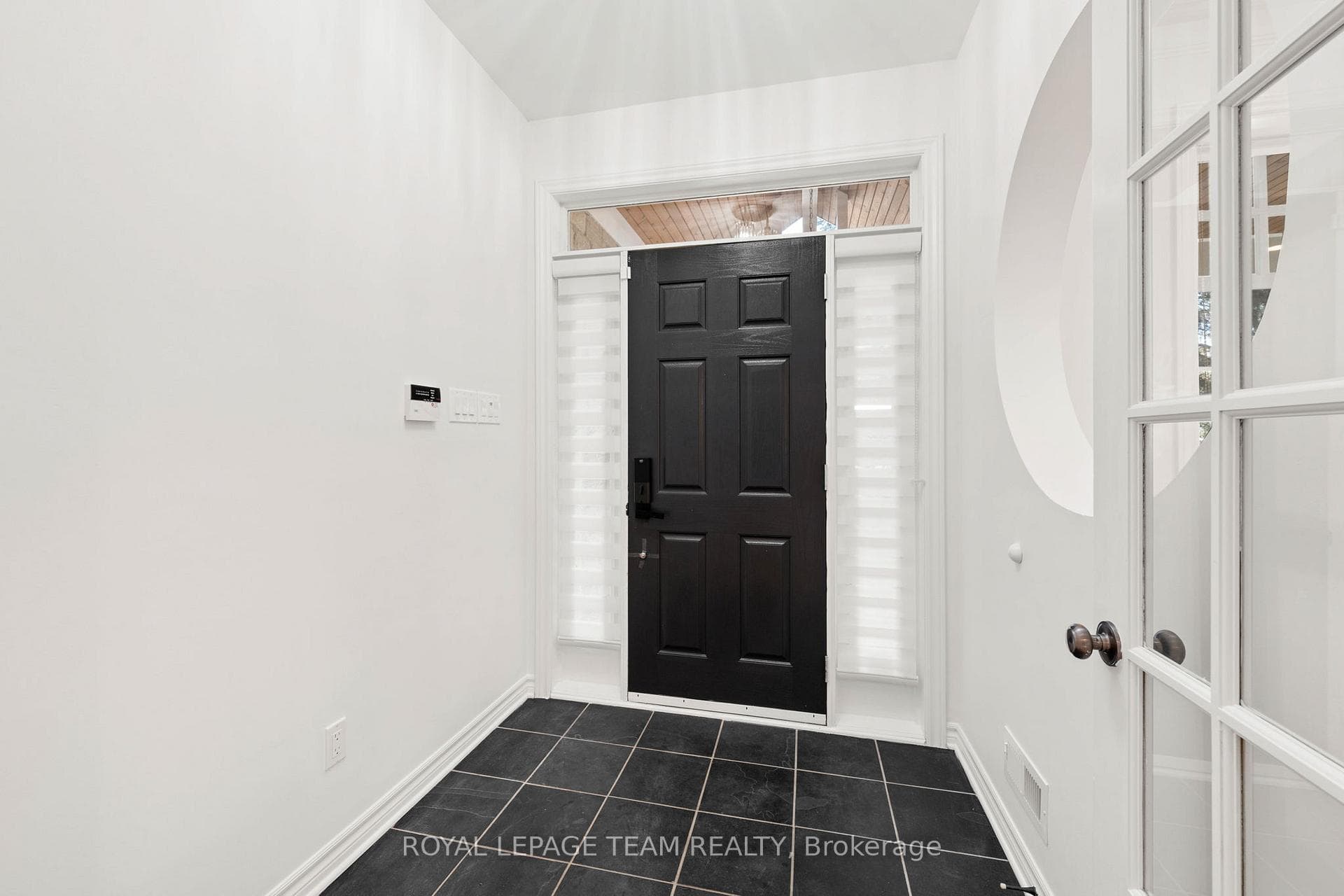Foyer opens with double French doors