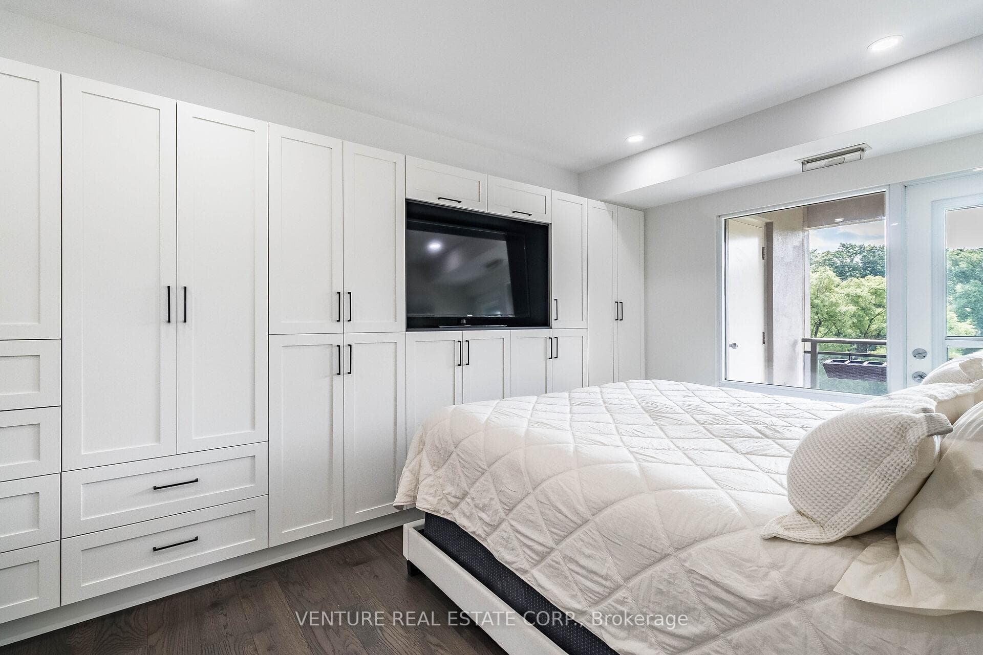 Primary BdRm B/I Cabinets & W/O Private Balcony
