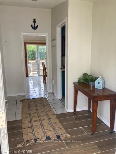 Corridor with dark wood-type flooring