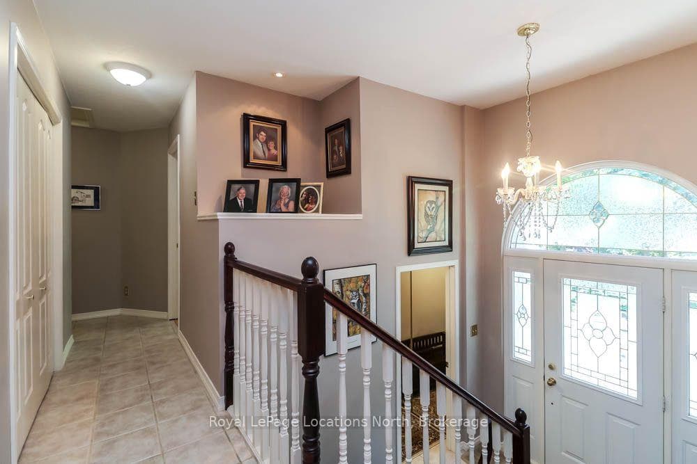 Bright Foyer + Hallway to Bedroom Area