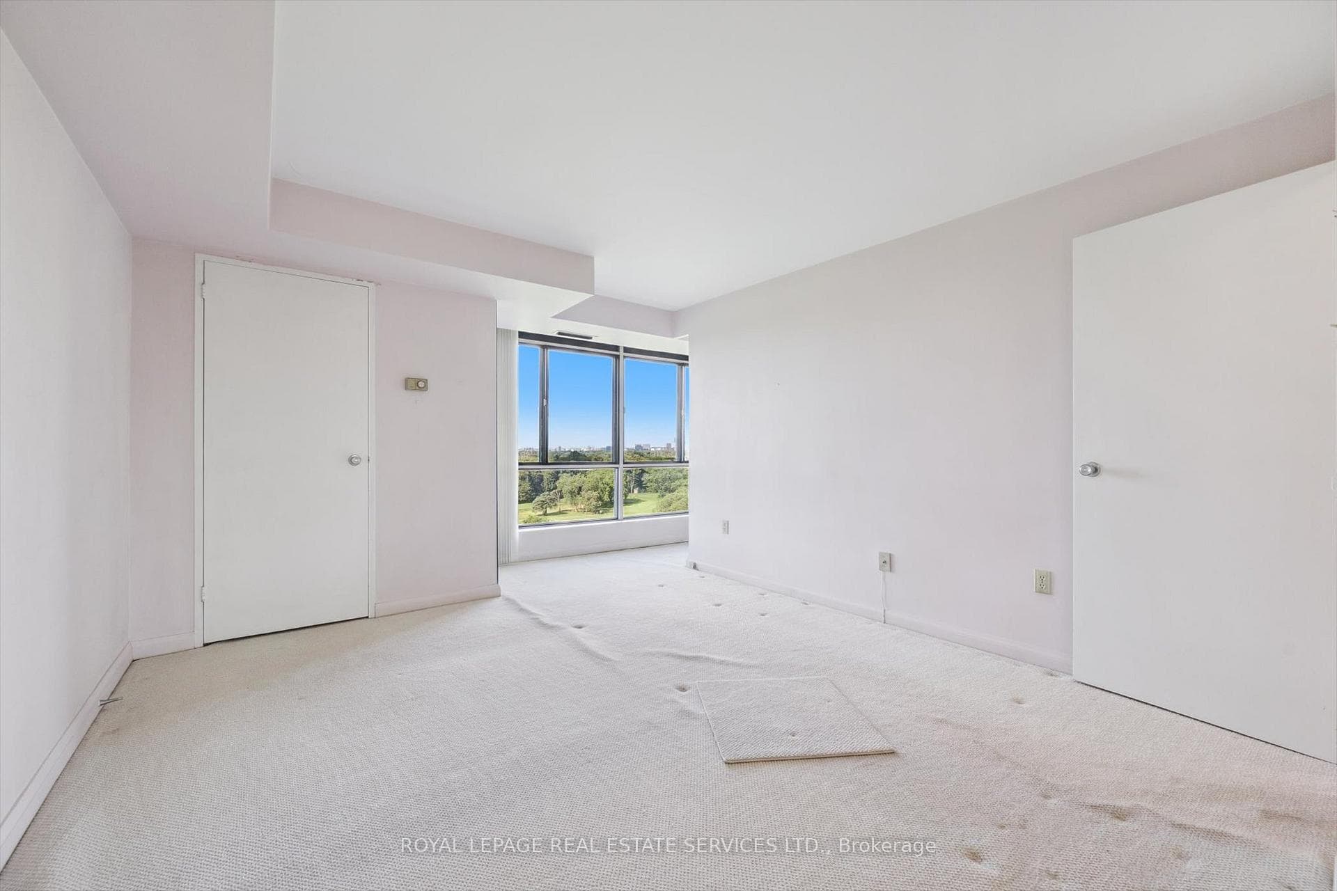 Floor-To-Ceiling Window in Primary Bedroom