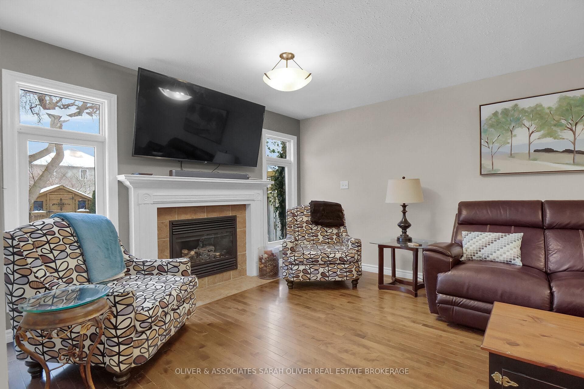 Bright windows either side of Fireplace Livingroom