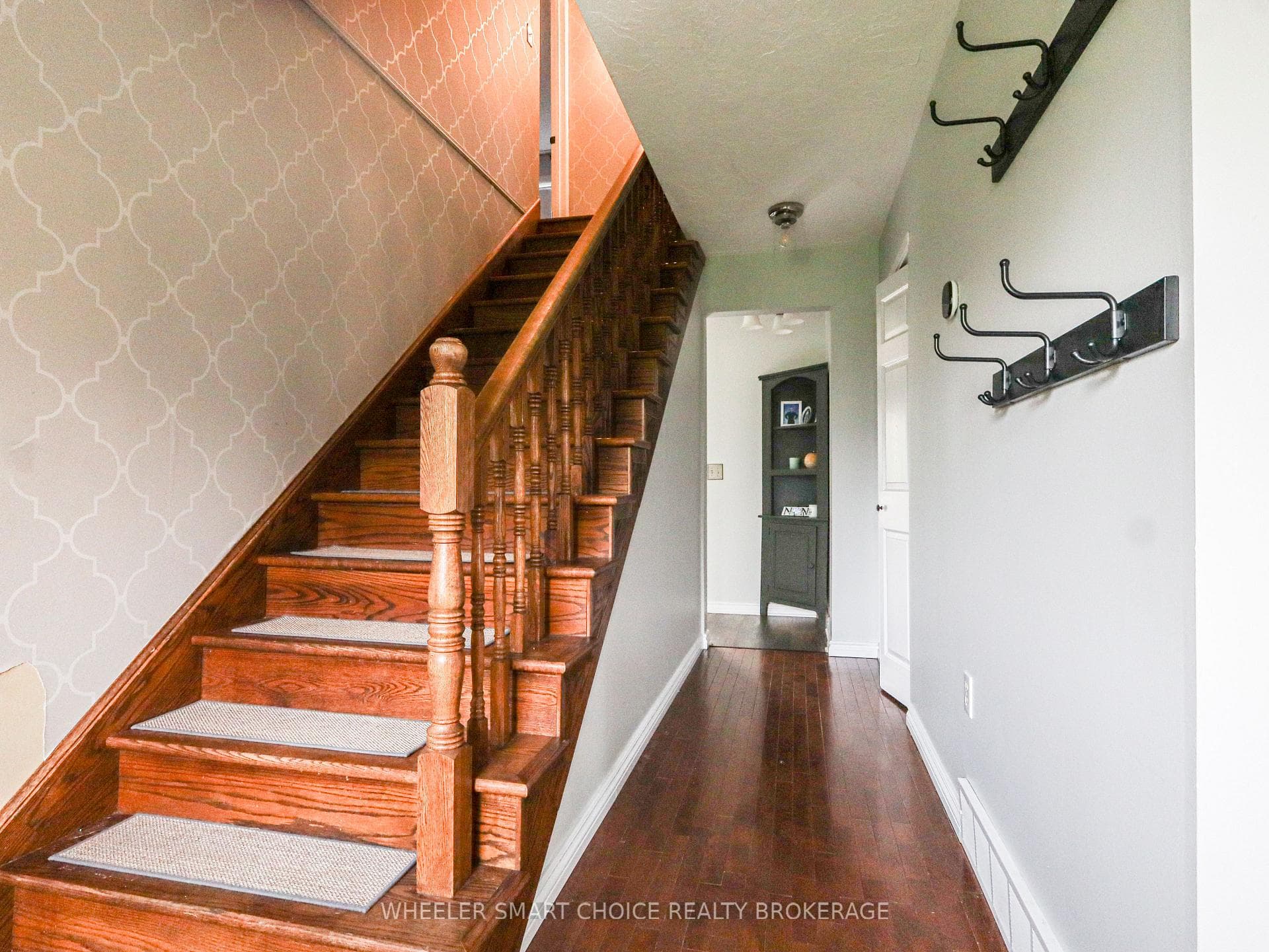 The wooden staircase to the second floor.