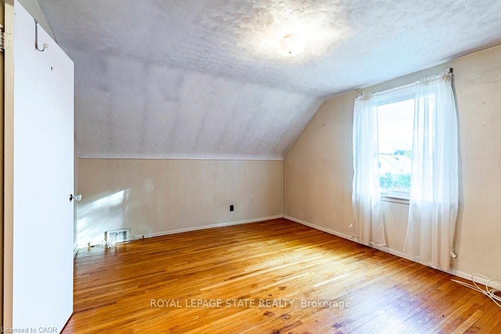 1 of 2 upper level bedrooms w/ hardwood & closet