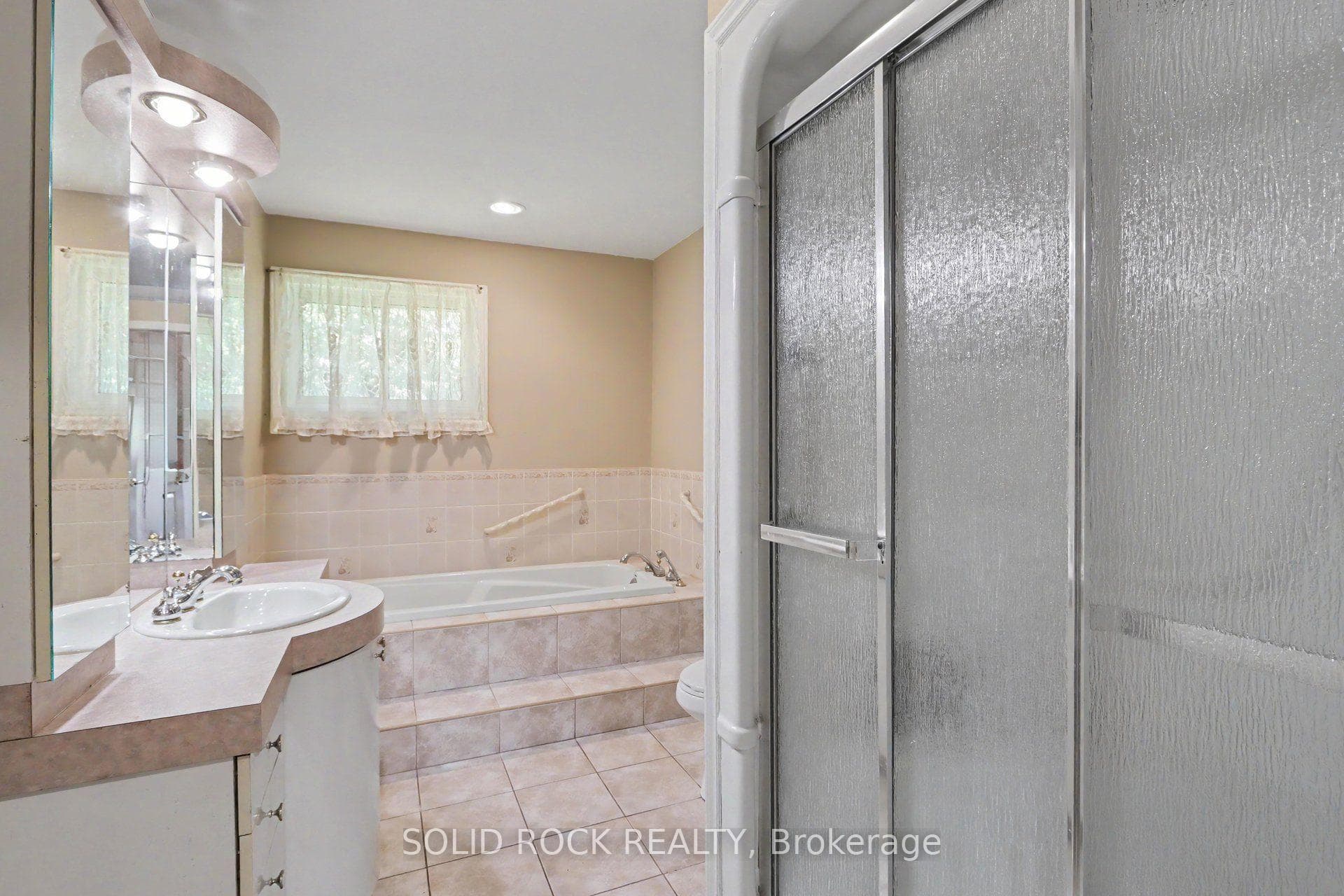 Spacious 4-piece bath with a Jacuzzi tub