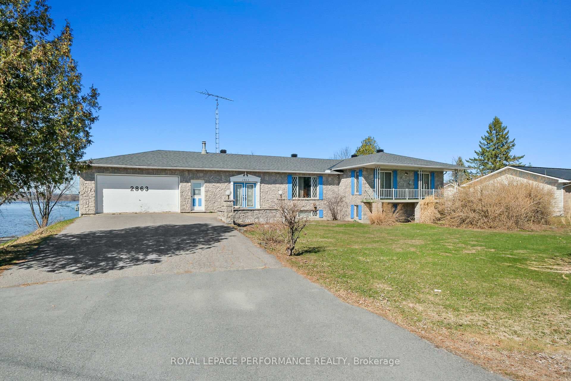 Front elevation wtih lots of driveway parking