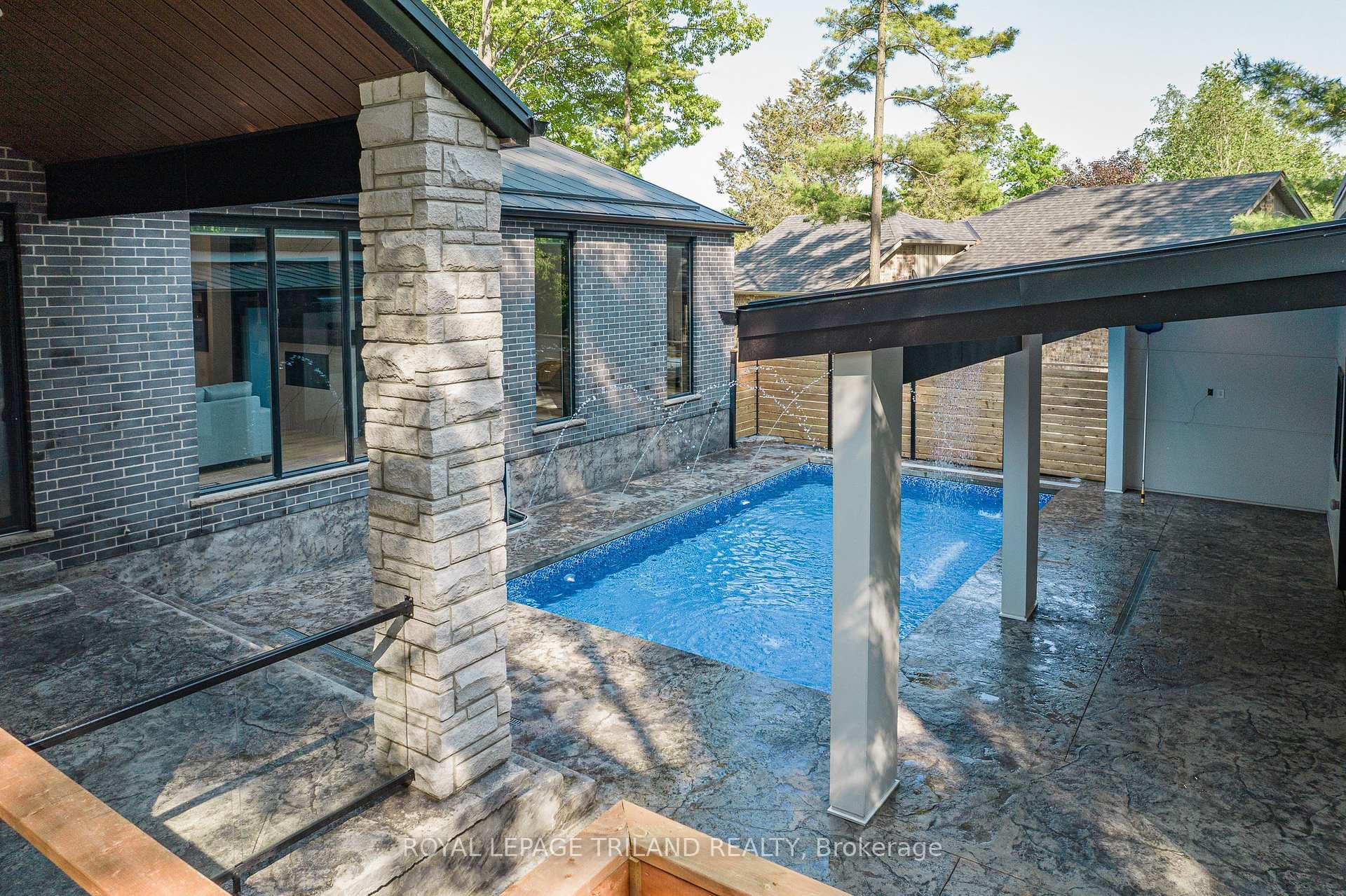 All low maintenance stamped concrete around pool