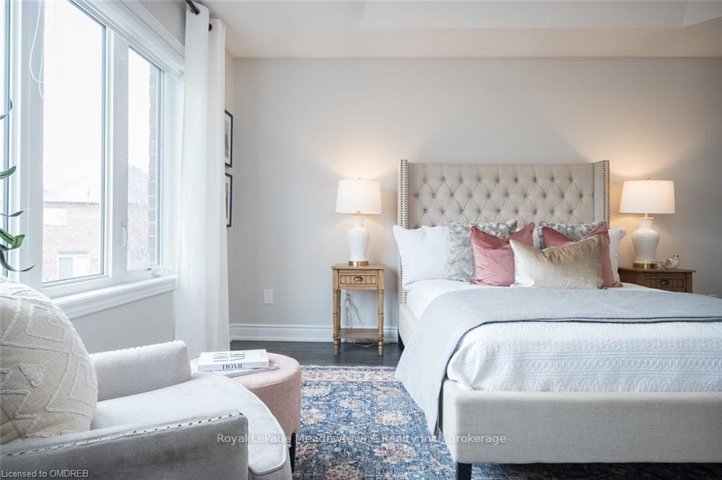 Primary bedroom with oversized windows with view o