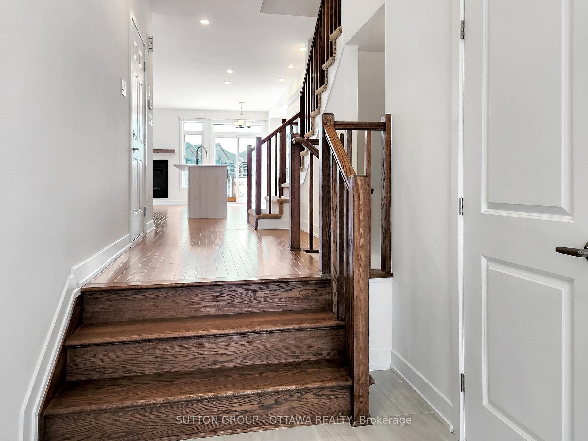 Entry with powder room on right