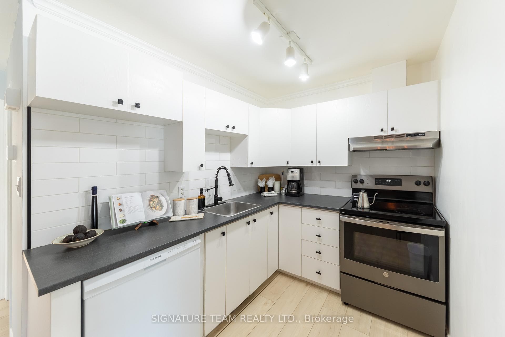 Cozy kitchen includes appliances.