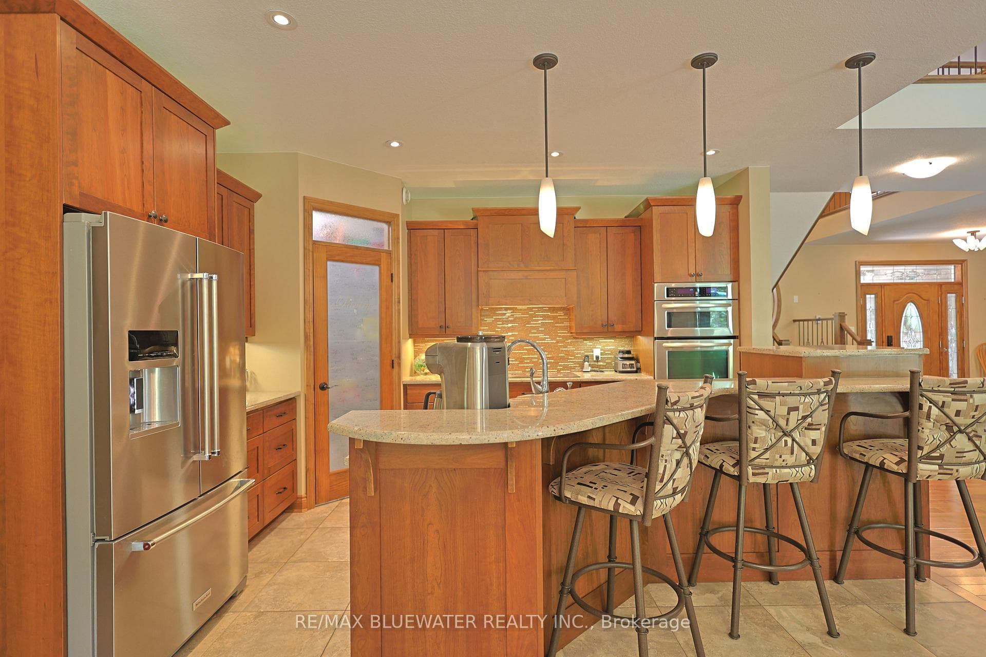 Spacious Kitchen With Island and Breakfast Bar