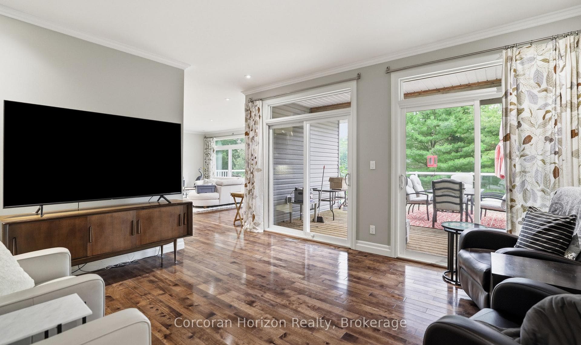 Main floor family room with walk out to deck
