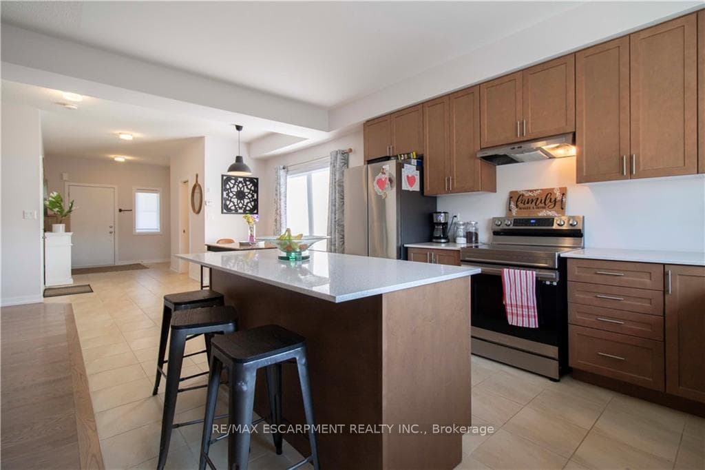 Kitchen With Breakfast Bar & SS Appliances