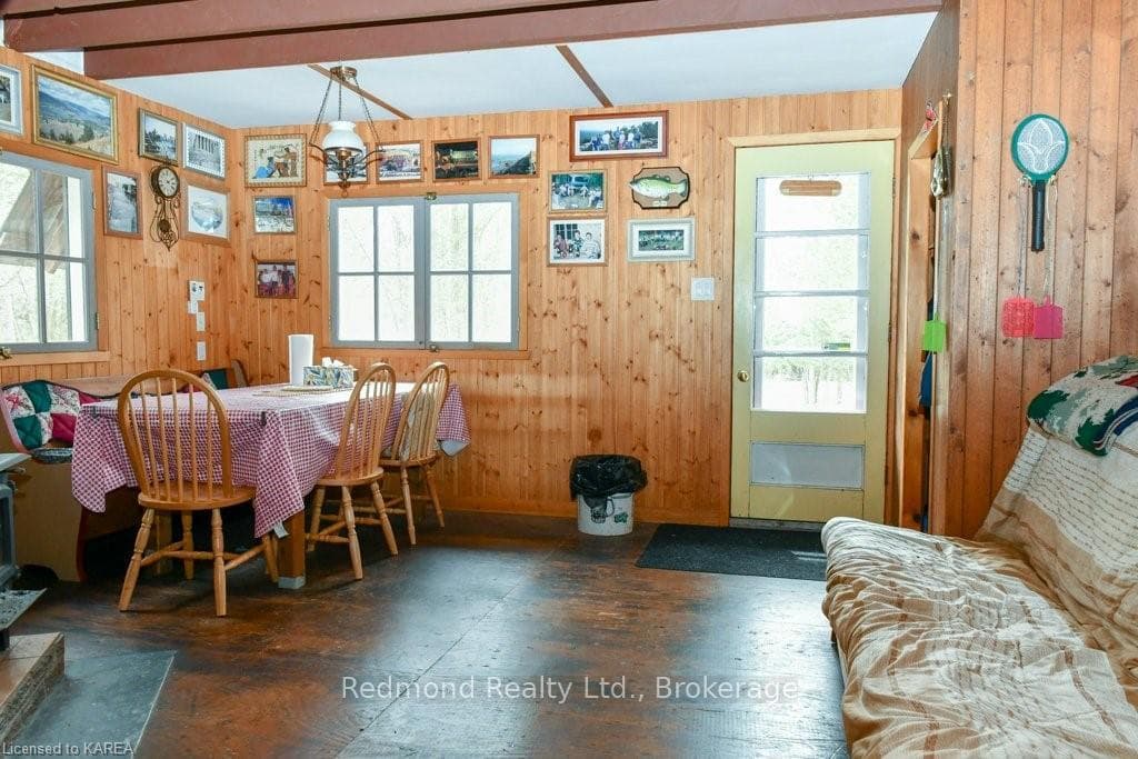Open concept living/dining area with door to deck