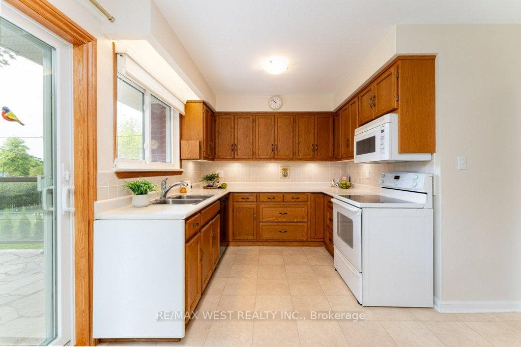 Renovated kitchen w/sliding dr. walk-out to patio.