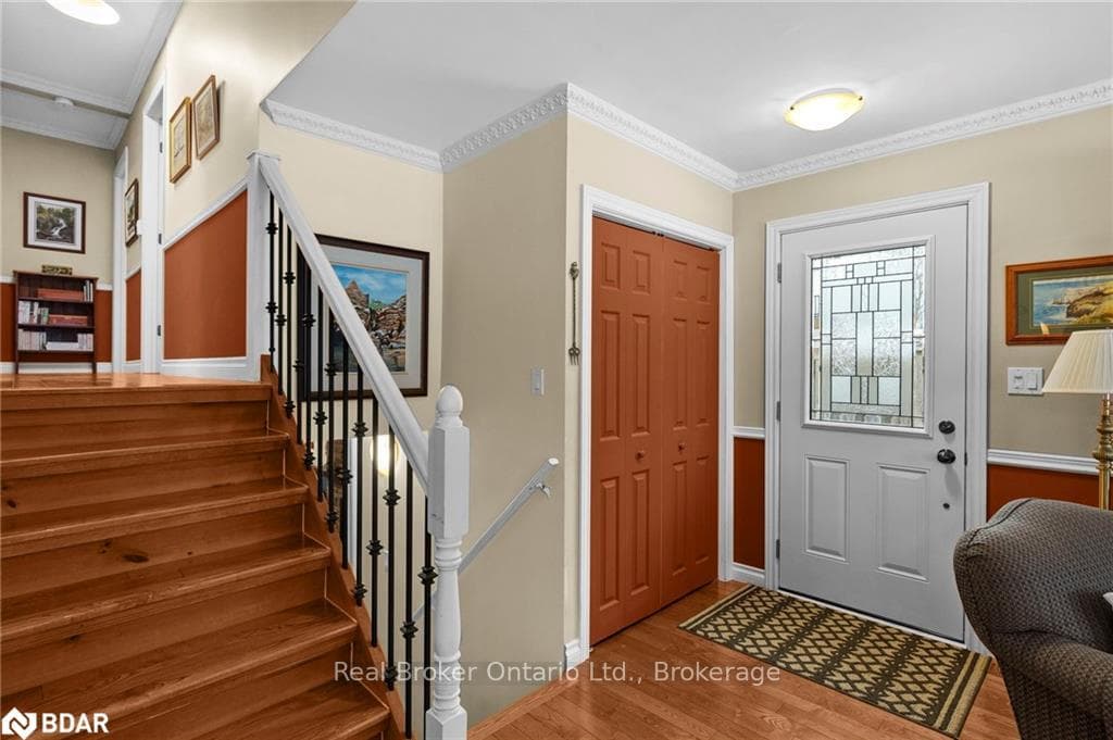 Foyer entrance with ornamental molding and light h