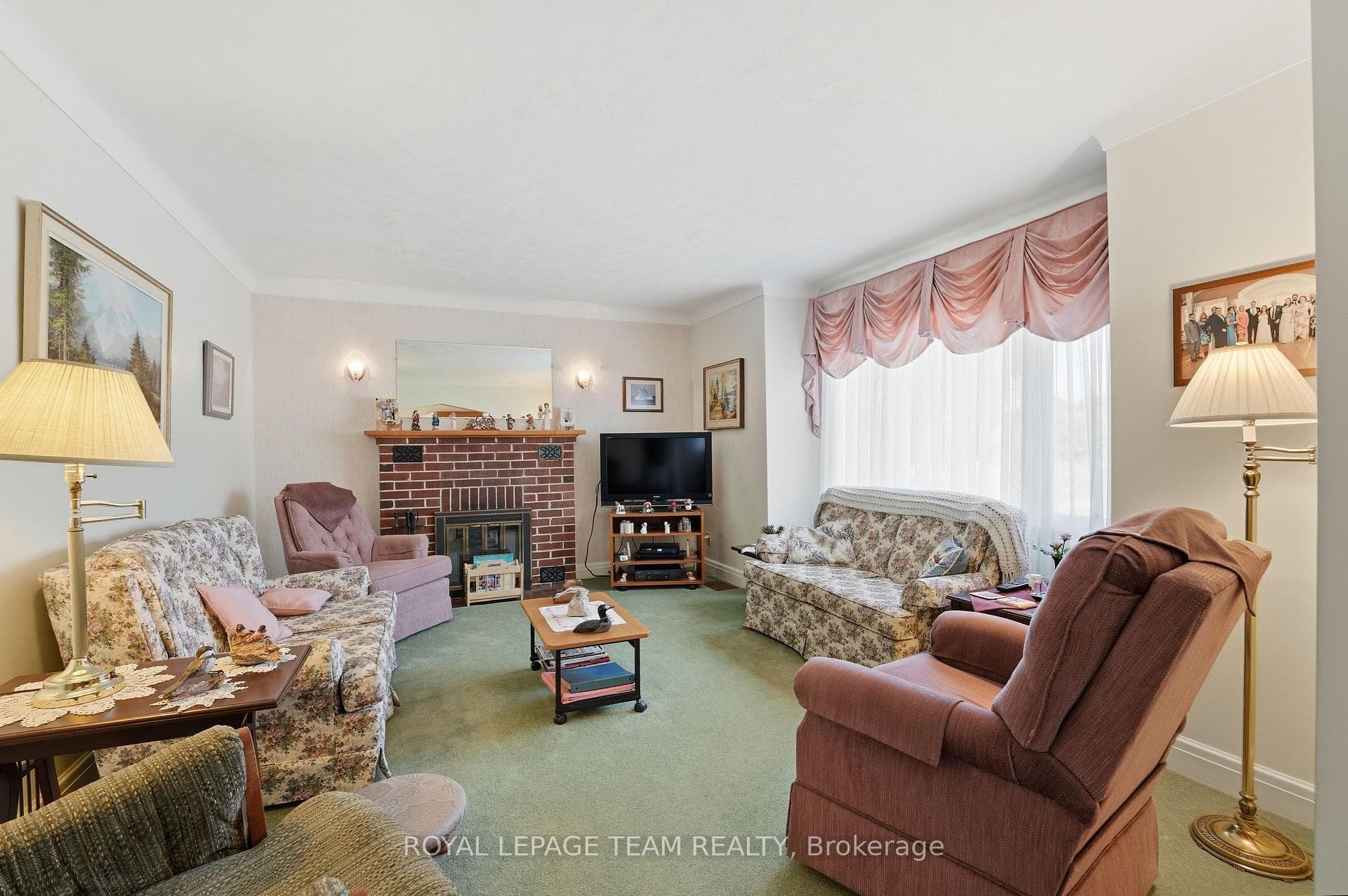 Living Room w/ Wood-Burning Fireplace