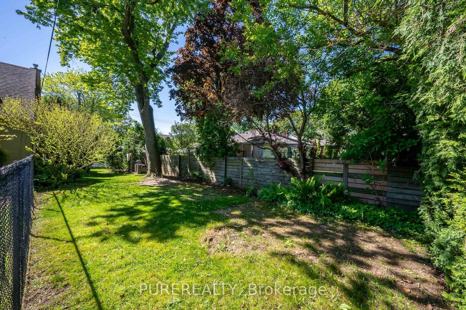 Grassy side lot with Gardens