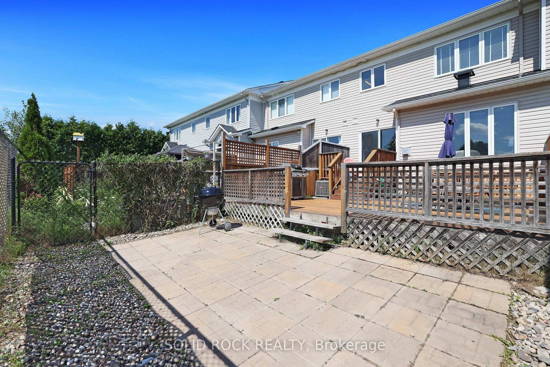 Additional patio area beyond the deck.