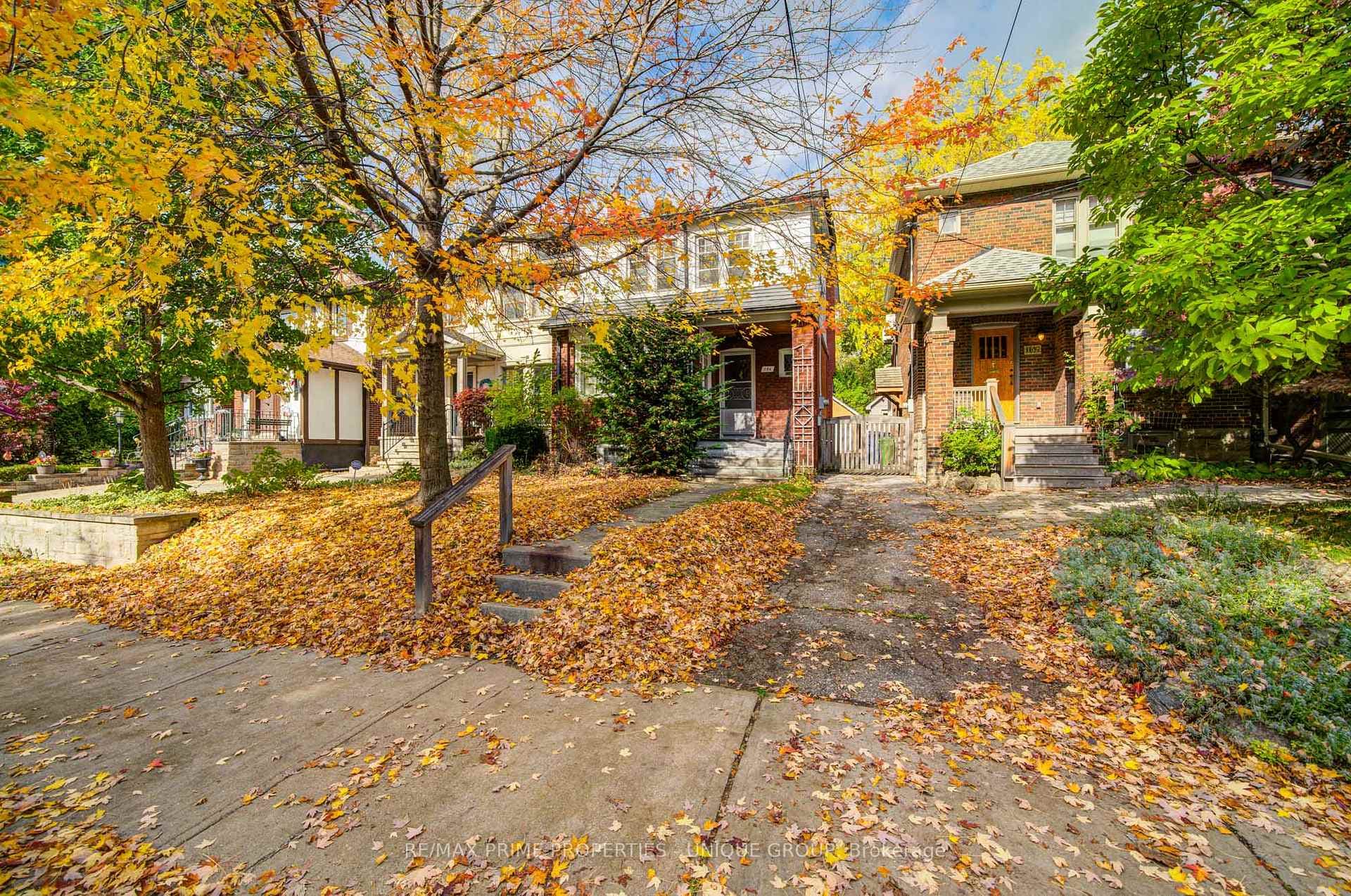 Front view of home with mutual drive to the right.