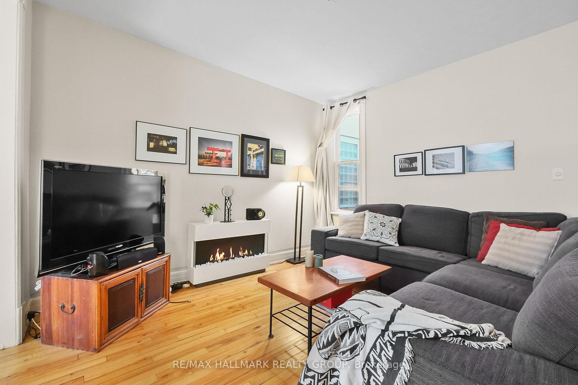 Large living room with wood floors.