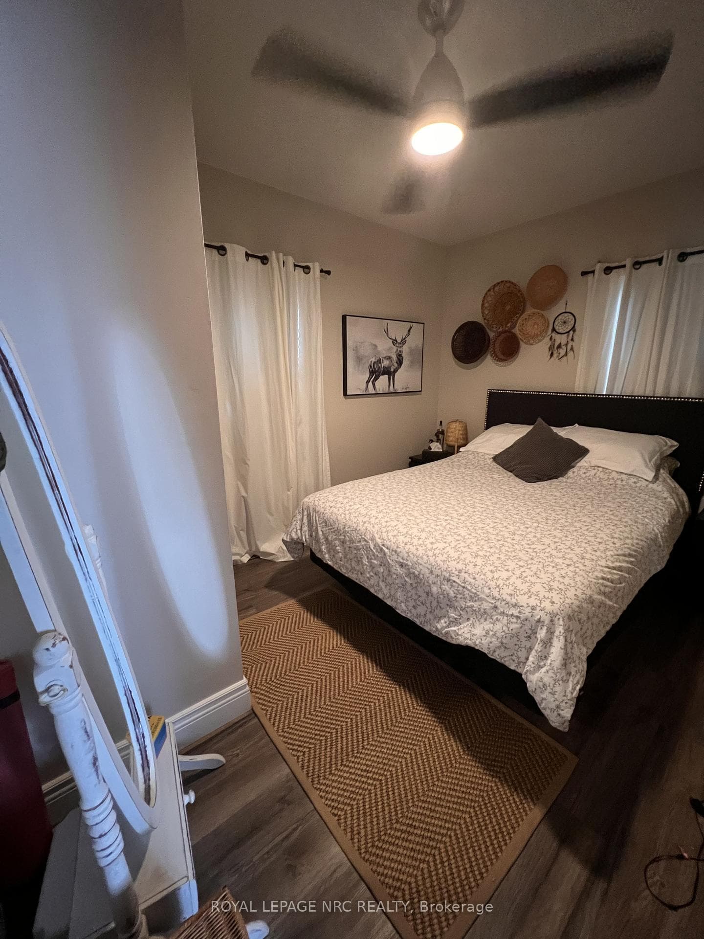 Upper unit, now vacant. Previous tenant photo.