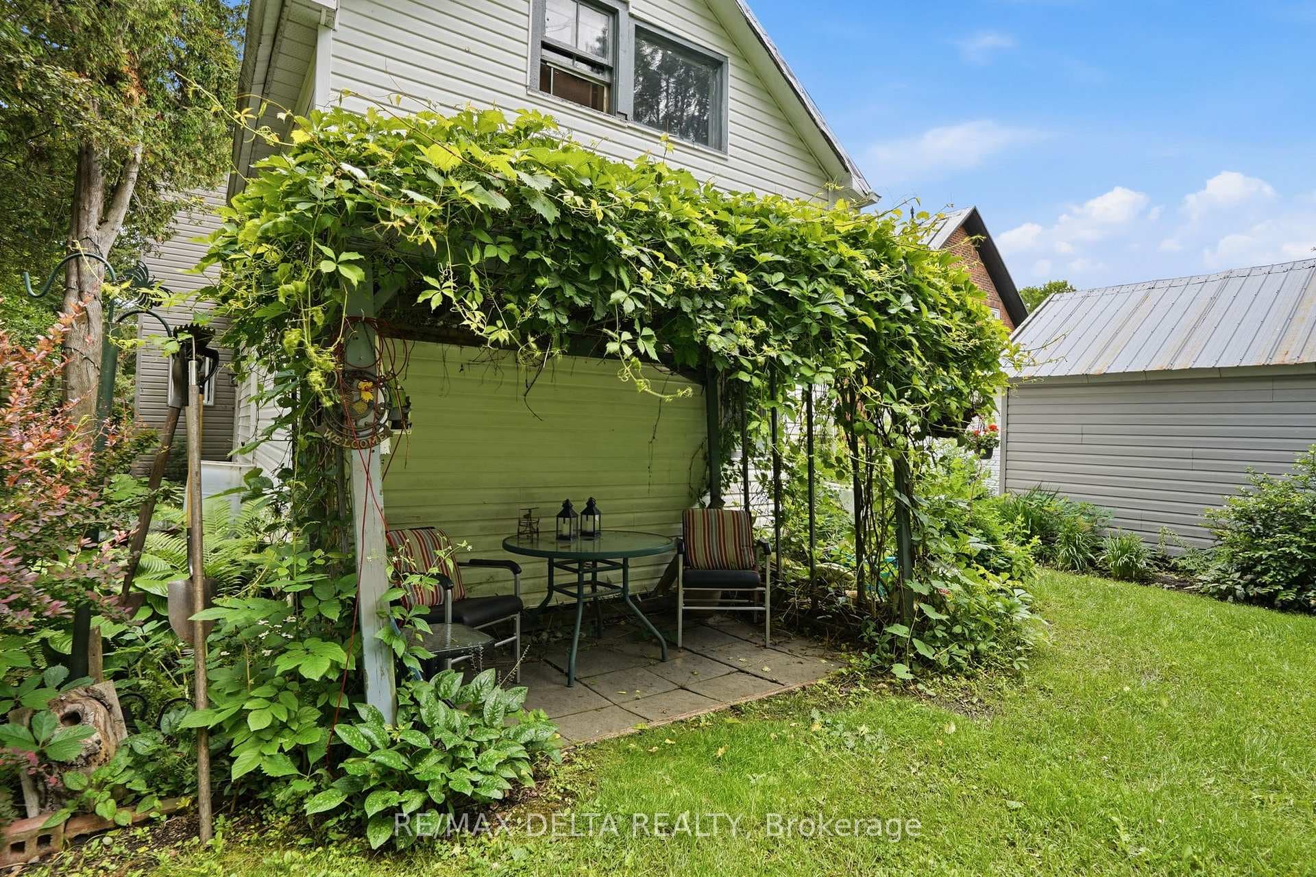 A shaded sitting area at the rear of the house.