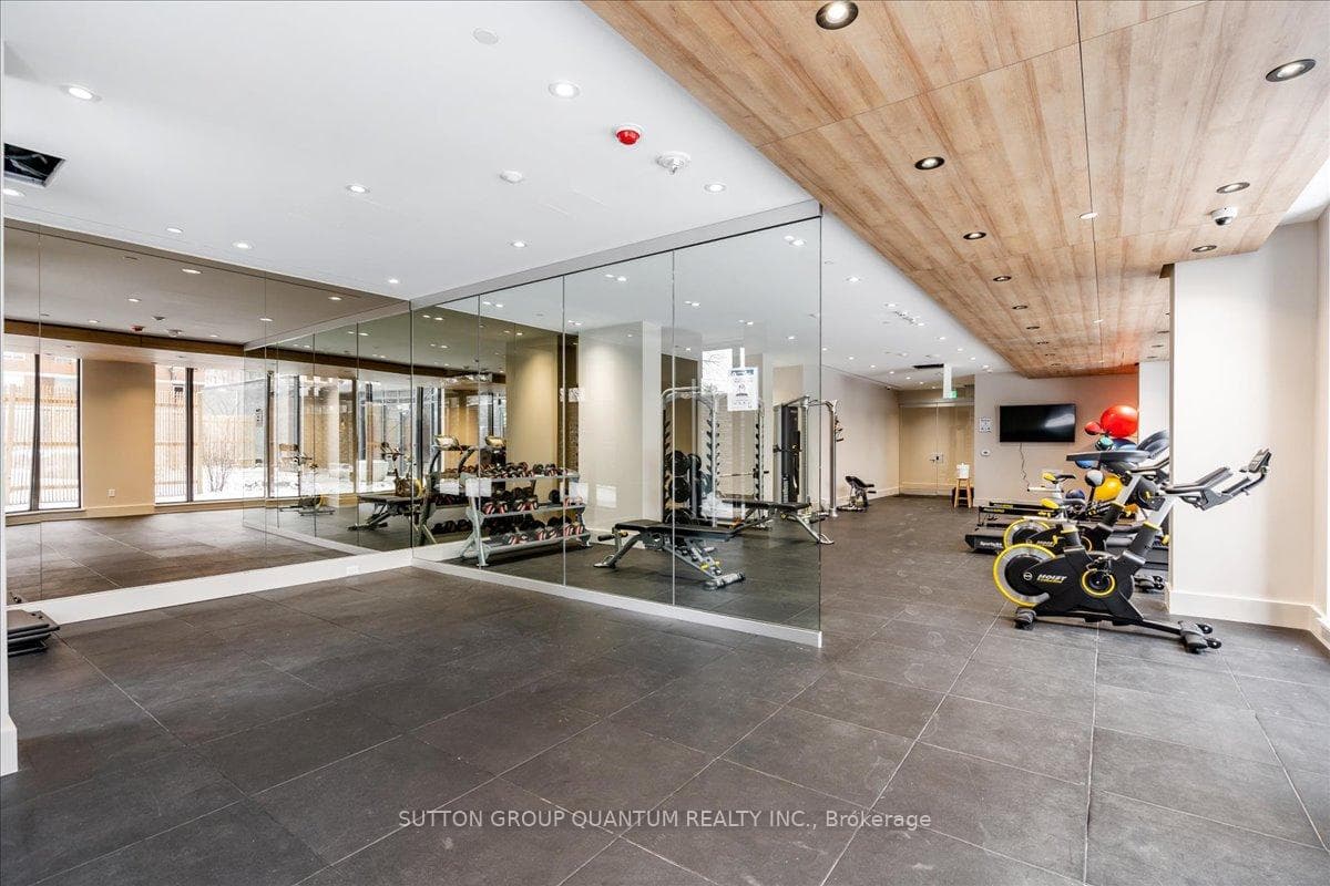 Gym with large windows overlooking courtyard