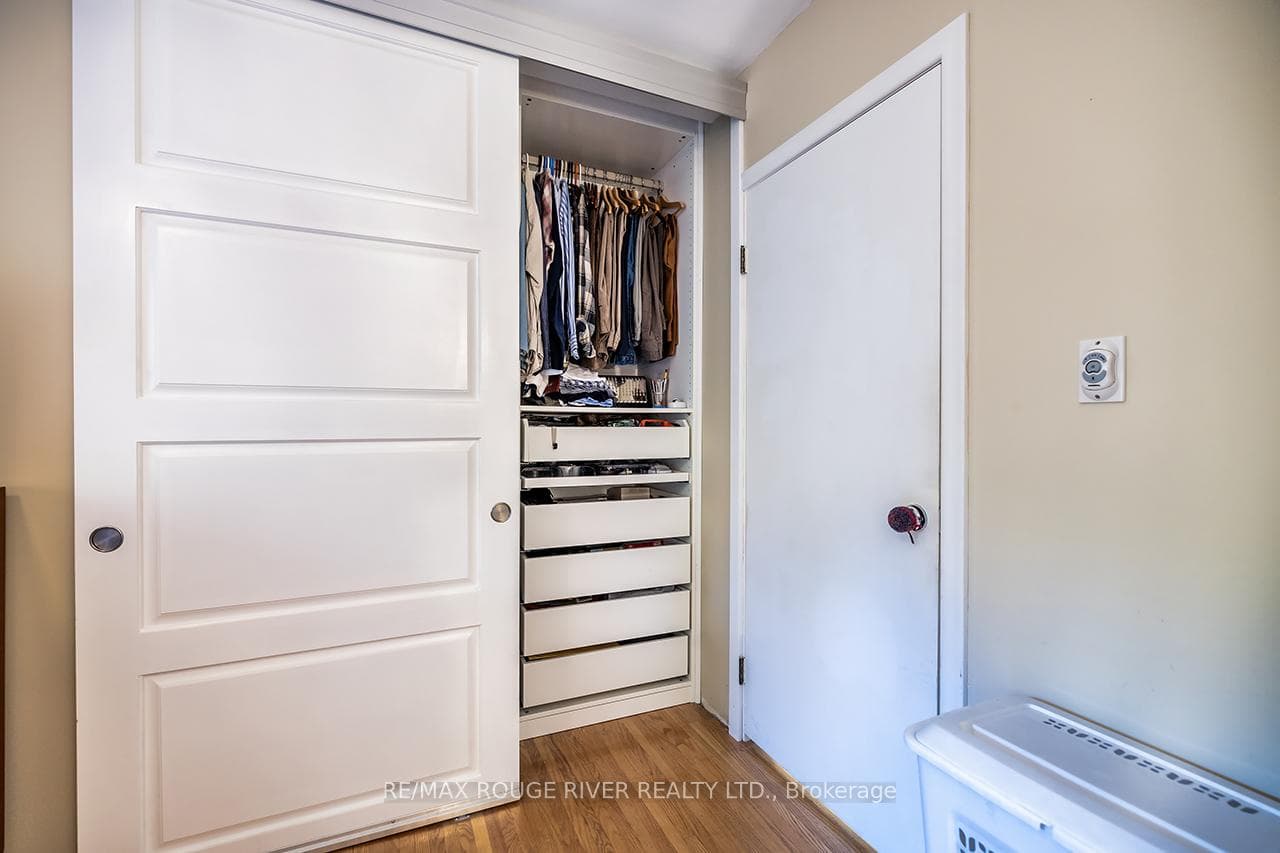 One of Two primary bedroom closets with shelving