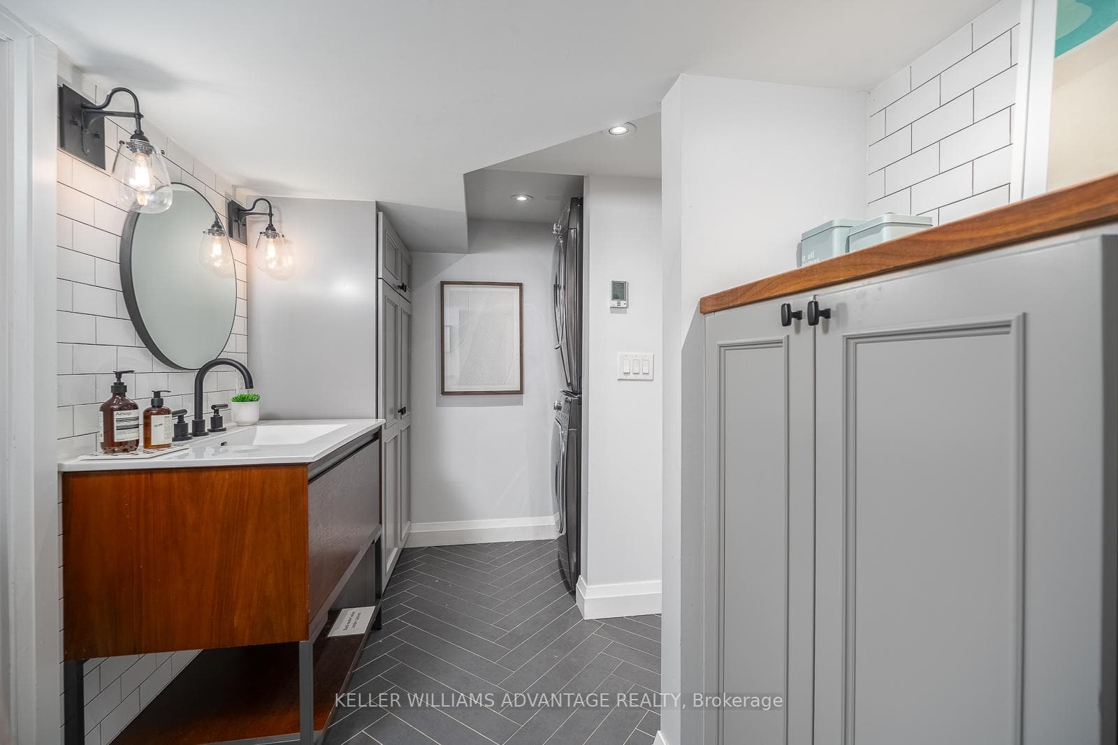 Lower level laundry & bathroom with heated floors