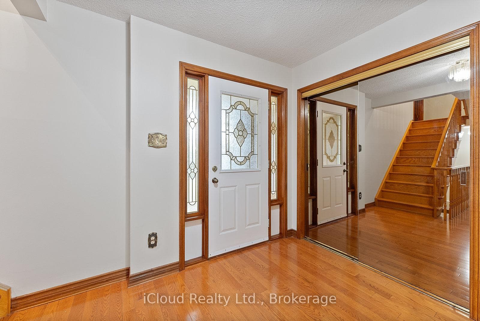 Foyer with Mirrored Sliding Closet Doors