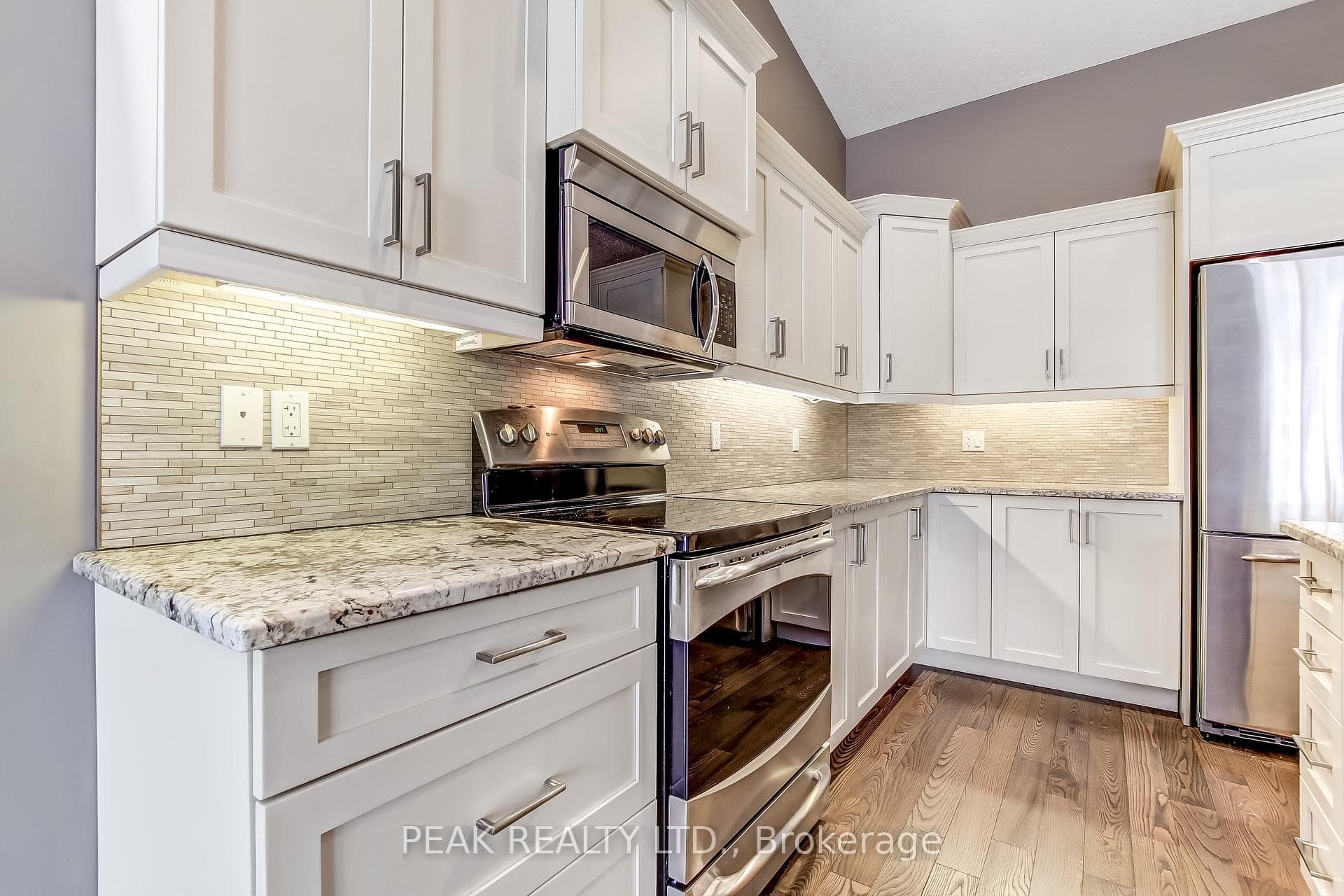Upgraded cabinets, crown and valance moulding.