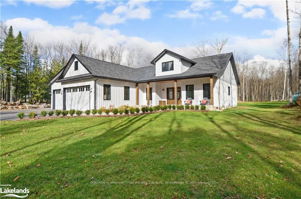 Modern farmhouse style home featuring a front lawn